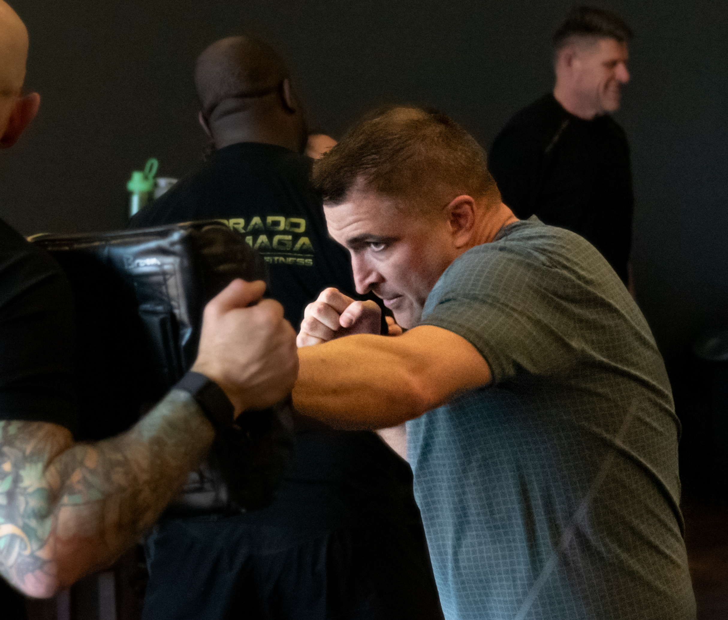 A photo of E.Z. punching during a Krav Maga class